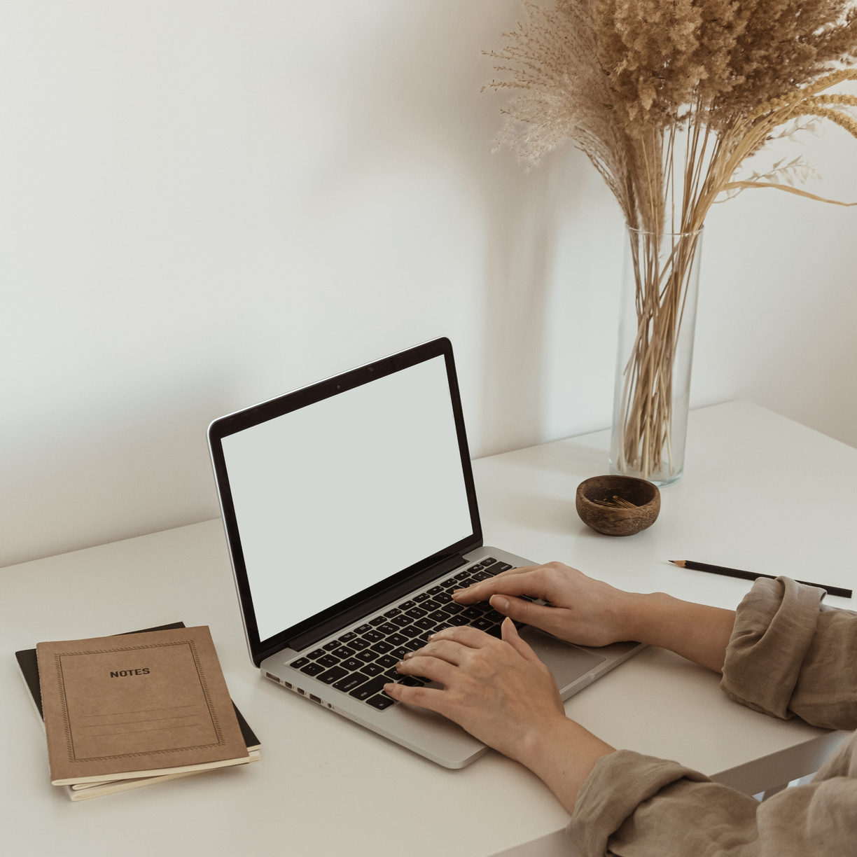 Woman Working on Blank Screen Laptop